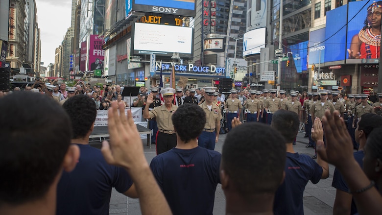 Lt. Gen. Rex C. McMillian, commander of Marine Forces Reserve and Marine Forces North, gives the oath of enlistment to potential recruits during the U.S. Marine Corps Forces Reserve Centennial celebration at Times Square, New York, Aug. 29, 2016. For 100 years, the Marine Corps Reserve has answered the call, serving as our nation’s crisis response force and expeditionary force in readiness. The centennial celebration is a way to honor this selfless service and celebrate the Marine Corps’ rich history, heritage and esprit de corps.