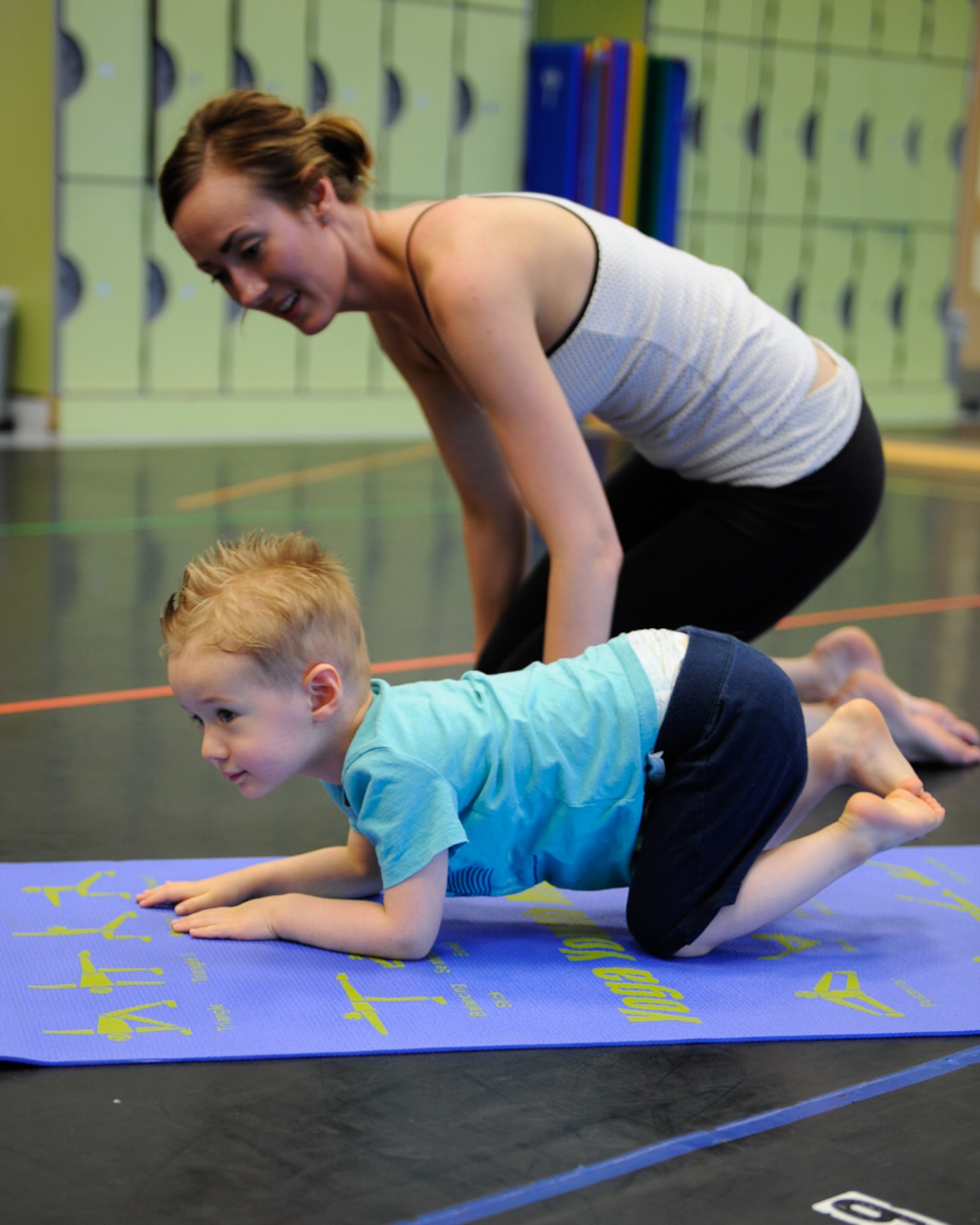 Jackson Parnell and mother Brandy Parnell move into the next yoga pose during a Mommy and Me Yoga course Aug. 29, 2016, at Ramstein Air Base, Germany. The instructor incorporated nontraditional names for poses to keep the young children more engaged, as well as created an environment to promote a deeper mother and child bond. (U.S. Air Force photo/ Airman 1st Class Savannah L. Waters)