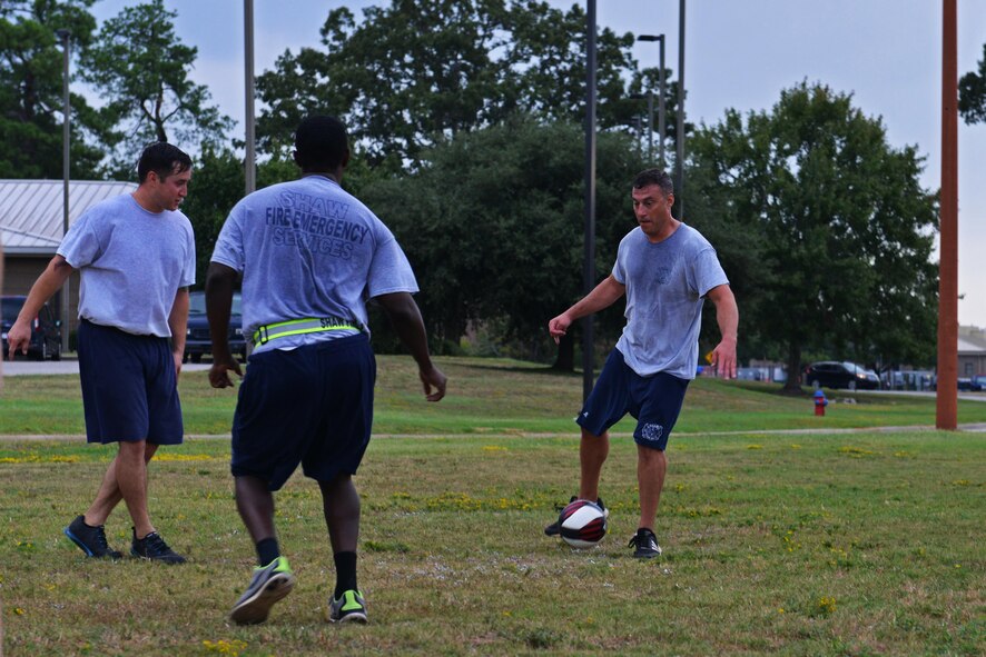 U.S. Airmen assigned to the 20th Civil Engineer Squadron fire department play soccer at Shaw Air Force Base, S.C., Aug. 30, 2016. Physical training is an aspect of the whole Airman concept, which emphasizes the maintenance of mental, social, physical and spiritual health. (U.S. Air Force photo by Airman 1st Class Destinee Sweeney)