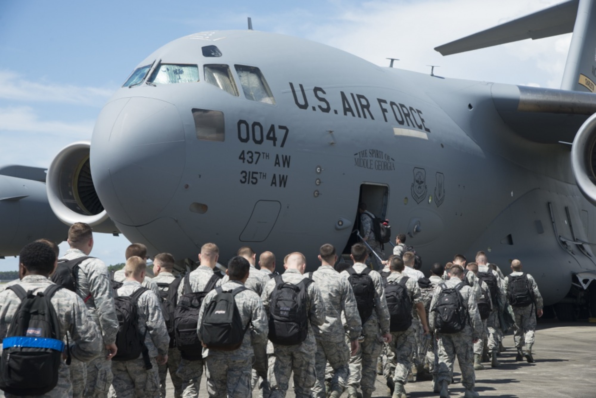 33rd Fighter Wing Airmen board a C-17 Globemaster III Aug. 19, 2016, at Eglin Air Force Base, Fla. The C-17 transported 33rd FW members to Volk Field, Wis. to take part in Northern Lightning, a tactical-level, joint training exercise that emphasizes fifth and fourth generation assets engaged in a contested, degraded environment. (U.S. Air Force photo by Senior Airman Stormy Archer)
