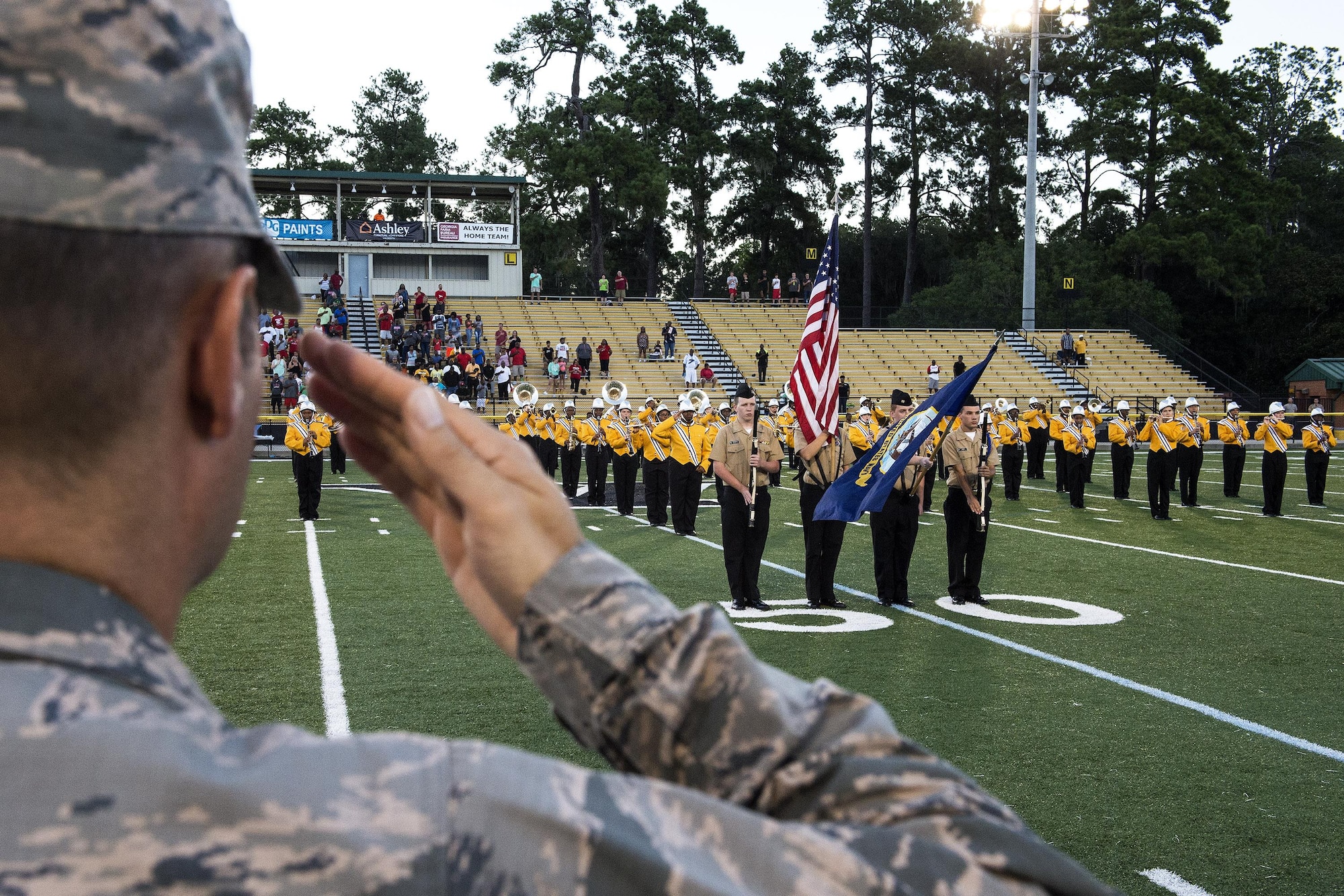 U.S. Air Force Col. Jay Vietas, 23d Medical Group commander, salutes the Valdosta High School Navy Junior Reserve Officer’s Training Corps color guard before a football game, Aug. 26, 2016, in Valdosta, Ga. VHS deemed the game Military Appreciation Night and honored past and present members of the U.S. armed forces with free admission and words of support and gratitude. (U.S. Air Force photo by Airman 1st Class Janiqua P. Robinson)