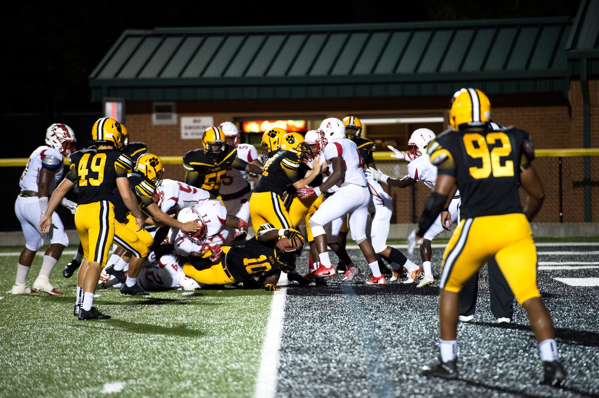 Tyrese Doe, no. 10, stretches across the end zone in hopes of scoring a touchdown during Military Appreciation Night, Aug. 26, 2016, in Valdosta, Ga. The officials ruled the play a ‘no goal’ saying Doe’s elbow was down before the ball crossed the line. (U.S. Air Force photo by Airman 1st Class Janiqua P. Robinson) 