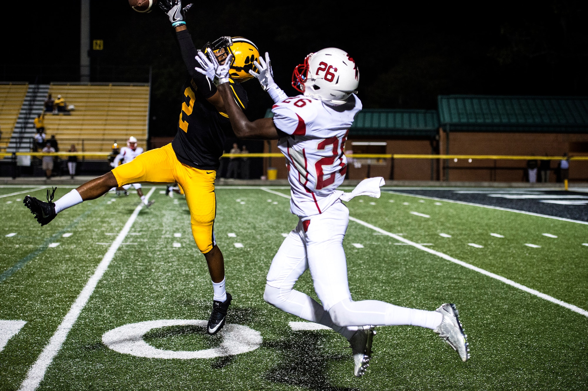 Jalen Harrell, no. 2 for Valdosta High School, extends his arms and breaks up a pass intended for Wallace Corker, no. 26 for Woodland High School, during Military Appreciation Night Aug. 26, 2016, in Valdosta, Ga. In the two games the Wildcats have played this year, Harrell has caught one interception and received two kickoff returns where he gained a total of 48 yards. (U.S. Air Force photo by Airman 1st Class Janiqua P. Robinson)
