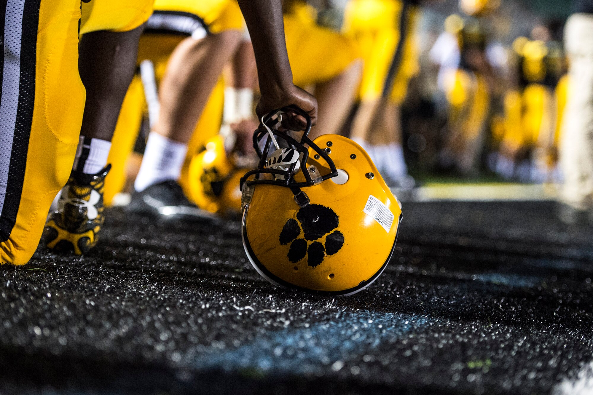 A Valdosta High School Wildcat takes a knee on the sideline, Aug. 26, 2016, in Valdosta, Ga. On Military Appreciation Night, the Wildcats defeated the Woodlawn Wolfpack 51 to 12, with 616 total yards, three interceptions and 18 first downs. (U.S. Air Force photo by Airman 1st Class Janiqua P. Robinson)