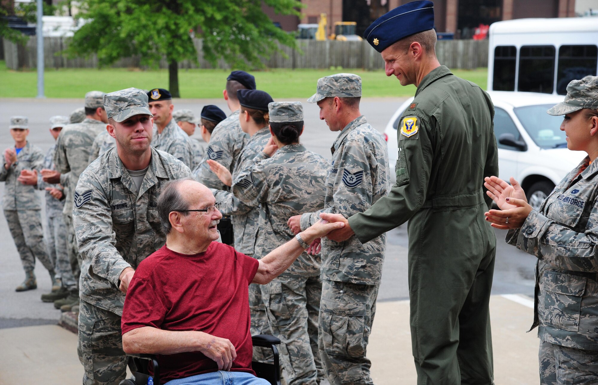 U.S. Air Force Maj. Joseph Knothe, a B-2 Spirit pilot from the 394th Combat Training Squadron, greets a veteran from the Missouri Veterans’ Home at Whiteman Air Force Base, Mo., Aug. 26, 2016. Approximately 20 veterans toured Whiteman and received briefings from various units on base. (U.S. Air Force photo by Senior Airman Joel Pfiester)