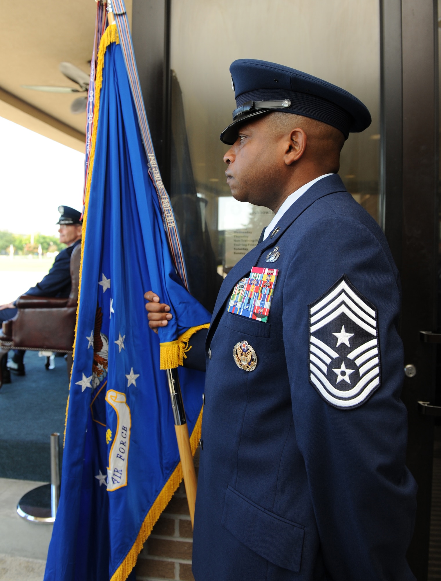 Chief Master Sgt. Farrell Thomas, 2nd Air Force command chief, holds the guidon during the 2nd AF change of command ceremony at the Levitow Training Support Facility Aug. 26, 2016, on Keesler Air Force Base, Miss. Maj. Gen. Bob LaBrutta, incoming 2nd AF commander, was previously the 502nd Air Base Wing and Joint Base San Antonio, Texas, commander. He replaces Maj. Gen. Mark Brown, who is heading to Joint Base San Antonio-Randolph, Texas, where he will become the Air Education and Training Command vice commander. (U.S. Air Force photo by Kemberly Groue/Released)