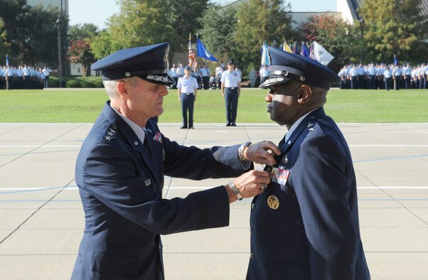 Lt. Gen. Darryl Roberson, commander, Air Education and Training Command, presents the Distinguished Service Medal to Maj. Gen. Mark Brown, outgoing 2nd Air Force commander, during the 2nd AF change of command ceremony at the Levitow Training Support Facility Aug. 26, 2016, on Keesler Air Force Base, Miss. Brown, who will become the AETC vice commander at Joint Base San Antonio-Randolph, Texas, is replaced by Maj. Gen. Bob LaBrutta, who was previously the 502nd Air Base Wing and Joint Base San Antonio, Texas, commander. (U.S. Air Force photo by Kemberly Groue/Released)