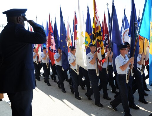 Maj. Gen. Mark Brown, outgoing 2nd Air Force commander, renders a salute as troops march during the pass and review following the 2nd AF change of command ceremony at the Levitow Training Support Facility Aug. 26, 2016, on Keesler Air Force Base, Miss. Brown, who will become the Air Education and Training Command vice commander at Joint Base San Antonio-Randolph, Texas, is replaced by Maj. Gen. Bob LaBrutta, who was previously the 502nd Air Base Wing and Joint Base San Antonio, Texas, commander. (U.S. Air Force photo by Kemberly Groue/Released)