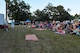 Members of Team Seymour watch a magic show during the postponed Independence Day celebration, Aug. 26, 2016, at Seymour Johnson Air Force Base, North Carolina. The event featured live music, food, family games, and fireworks. (U.S. Air Force photo by Airman Shawna L. Keyes) 