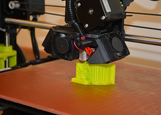 Users of the Maker Hub’s 3-D printer can make their own creations using computer-aided design or can explore the many shared designs available through the vast online Maker community.  (U.S. Air Force photo/Lori Hughes)