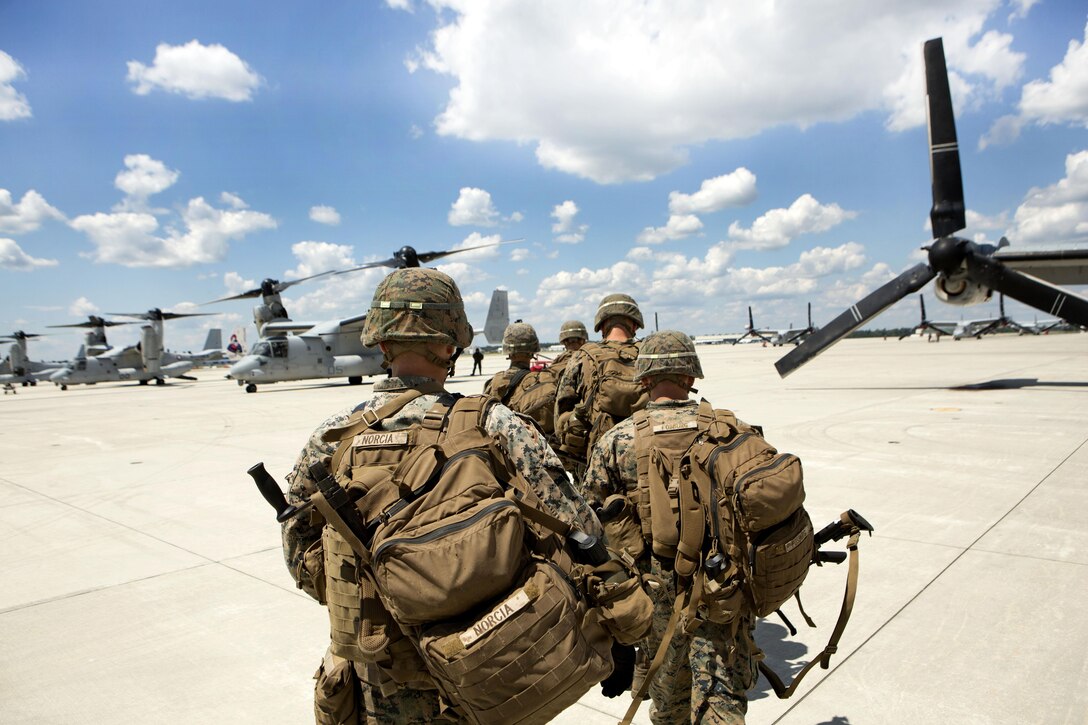 Marines make their way to a MV-22 Osprey before taking part in a vertical assault training raid at Marine Corps Air Station New River, N.C., Aug. 23, 2016. The Marines, assigned to Lima Company, Battalion Landing Team, 3rd Battalion, 6th Marine Regiment, are conducting predeployment training in preparation for the 24th Marine Expeditionary Unit’s upcoming deployment. Marine Corps photo by Lance Cpl. Melanye E. Martinez
