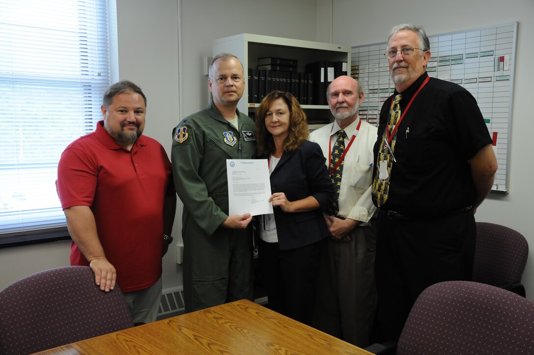Col. Brian Bowman, commander, 914th Airlift Wing and Dan Norton (left), director of Psychological Health, 914 AW, pose for a photo with Laura Kellemen, director, Niagara County Department of Mental Health, Michael White (right), deputy director and Jim Swift (far right), supervising social worker during a visit to their office on Aug. 25, 2016. Bowman and Dan Norton, Director of Psychological Health, 914 AW (far left) were there to present a letter of recognition. (U.S. Air Force photo by Tech. Sgt. Matthew Burke) 