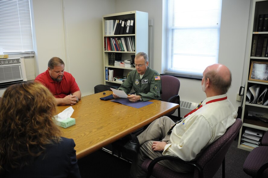 Col. Brian Bowman, commander, 914th Airlift Wing, reads from a letter of recognition from Lt. Gen. James Jackson to members of the Niagara County Department of Mental Health on Aug. 25, 2016. The letter was thanked the organization for their work with Dan Norton (left), Director of Psychological Health, 914 AW. (U.S. Air Force photo by Tech. Sgt. Matthew Burke)