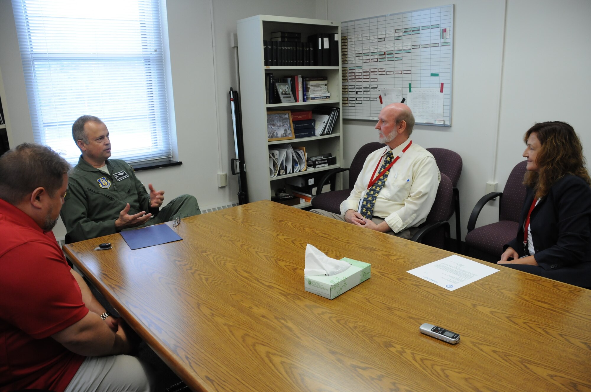 Col. Brian Bowman, commander, 914th Airlift Wing talks with Michael White, deputy director and Laura Kelemen, (far right) director, Niagara County Department of Mental Health during a visit to their office on Aug. 25, 2016. Bowman and Dan Norton, Director of Psychological Health, 914 AW (far left) were there to present a letter of recognition. (U.S. Air Force photo by Tech. Sgt. Matthew Burke) 