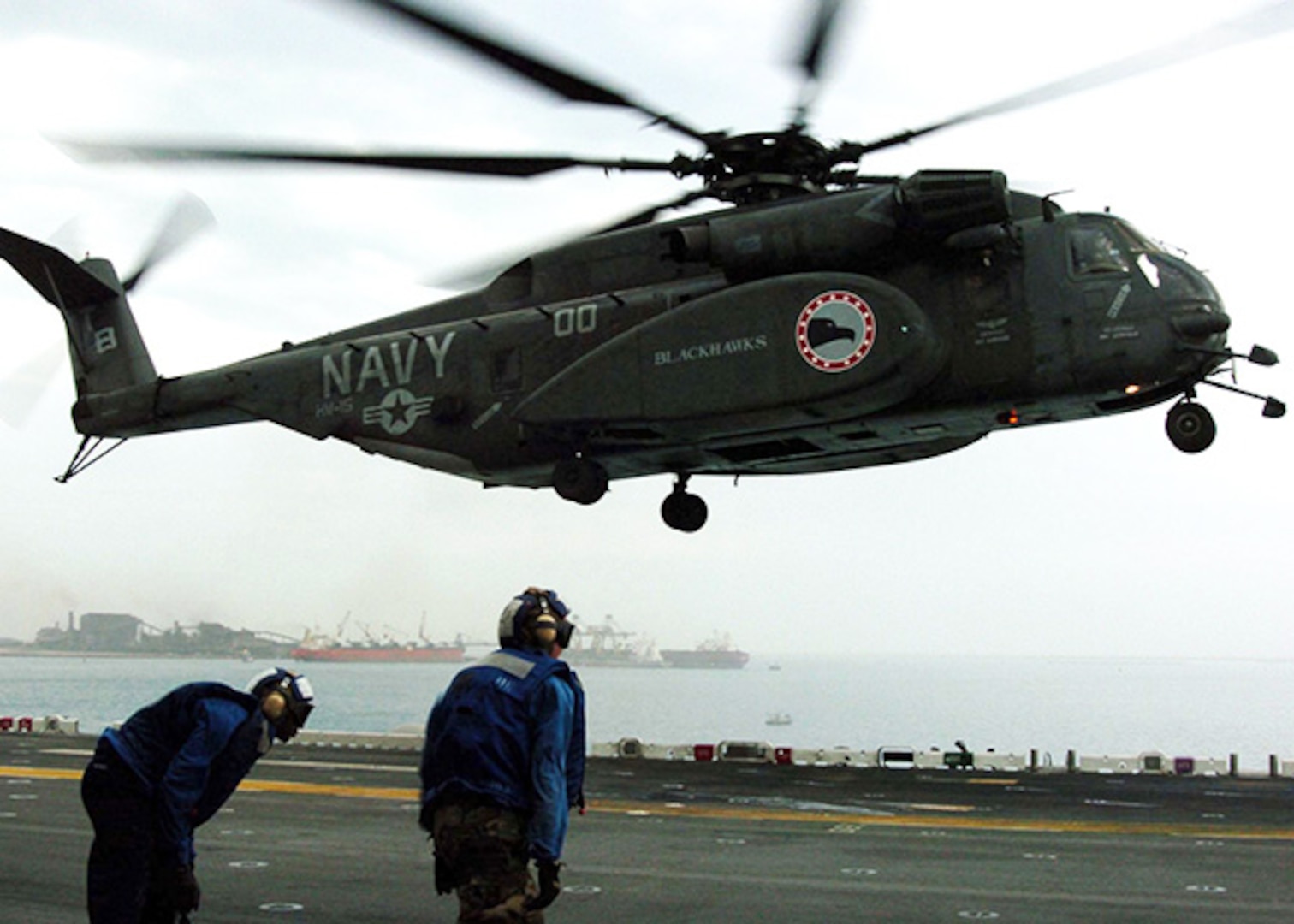 Persian Gulf (Jan. 10, 2005) - An MH-53E Sea Dragon helicopter, assigned to the "Blackhawks" of Helicopter Mine Countermeasures Squadron Fifteen (HM-15), lands on the flight deck aboard the amphibious assault ship USS Essex (LHD 2). Essex is undergoing preparations to support Operation Unified Assistance, the humanitarian operation effort in the wake of the Tsunami that struck South East Asia. 
 
    
