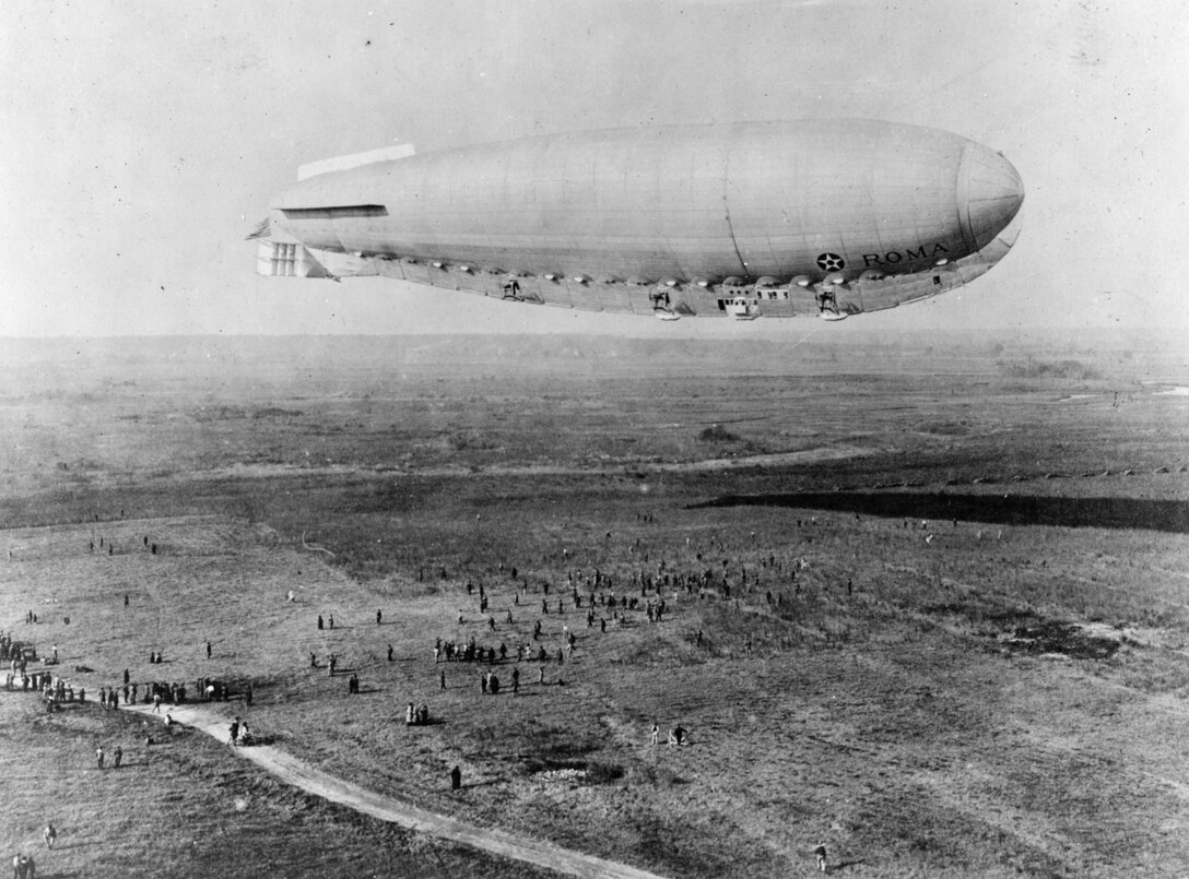 The Roma began a trip to test the new power plants at Langley Field, Va., on Feb. 21, 1922. It was cold and overcast as the crew of 45 men flew, the nose had started to buckle not long after leaving the field and observers at the air station watched in horror as the elevator in the stern slipped out of place. With its controls jammed, the Roma crashed at the Army’s Quartermaster Depot outside Norfolk, struck high-voltage wires and blew apart. (U.S. Air Force photo)
