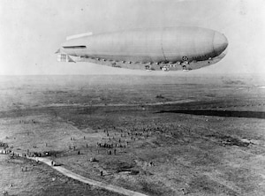 The Roma began a trip to test the new power plants at Langley Field, Va., on Feb. 21, 1922. It was cold and overcast as the crew of 45 men flew, the nose had started to buckle not long after leaving the field and observers at the air station watched in horror as the elevator in the stern slipped out of place. With its controls jammed, the Roma crashed at the Army’s Quartermaster Depot outside Norfolk, struck high-voltage wires and blew apart. (U.S. Air Force photo)