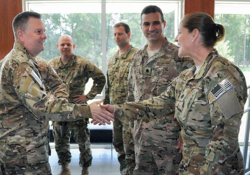 Lt. Gen. Brad Webb, commander of Air Force Special Operations Command, is welcomed by Lt. Col. Leslie Hadley, 711th Special Operations Squadron commander at Duke Field, Fla, Aug. 26. The visit was Webb’s first to the 919th Special Operations Wing since taking the helm of AFSOC.  (U.S. Air Force photo/Dan Neely)