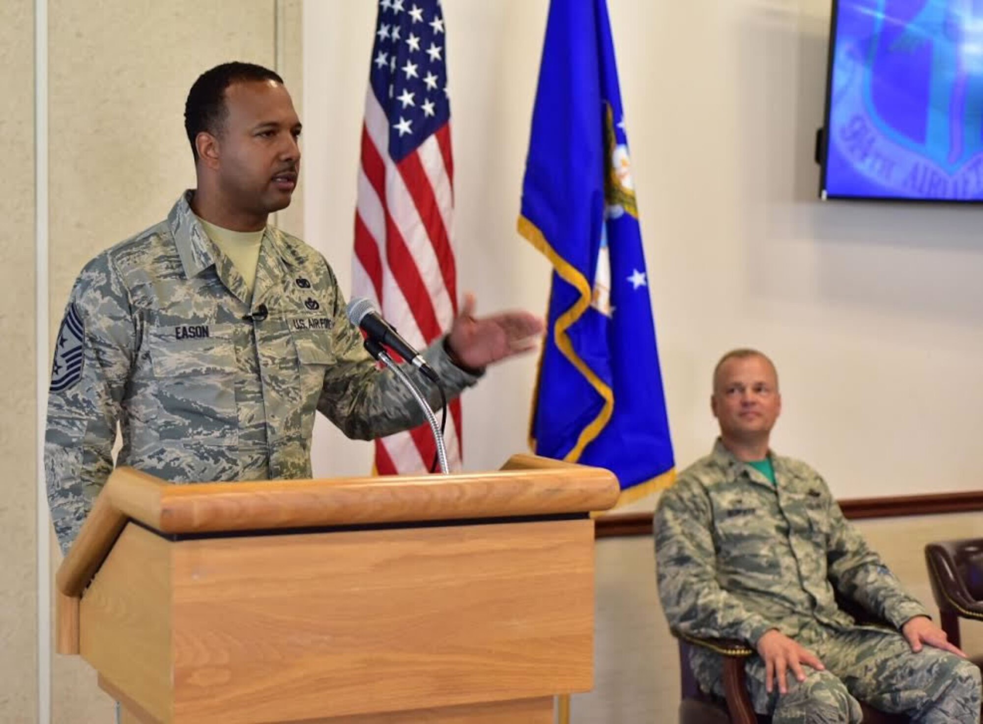 Chief Master Sgt. Kenneth Eason, command chief, 914th Airlift Wing, addresses members of his family and the 914 AW during a ceremony at Niagara Falls Air Reserve Station on Aug. 6, 2015. Eason assumes the responsibility of the highest enlisted position in the Wing. (U.S. Air Force photo by Staff Sgt. Richard Mekkri)