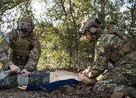 Tech. Sgt. David Mobley and Capt. Chuck Anderson, 711th Special Operations Squadron, perform combat first aid on a simulated victim during a training session at Duke Field, Fla.  The Airmen are combat aviation advisors.  A CAA mission sends a small team of Airmen to assess, advise, train, and assist friendly and allied forces with their own airpower resources.  The training aims to improve the partner nation's air capabilities quickly and show them a way to move forward effectively.  (U.S. Air Force photo/Tech. Sgt. Sam King)  
