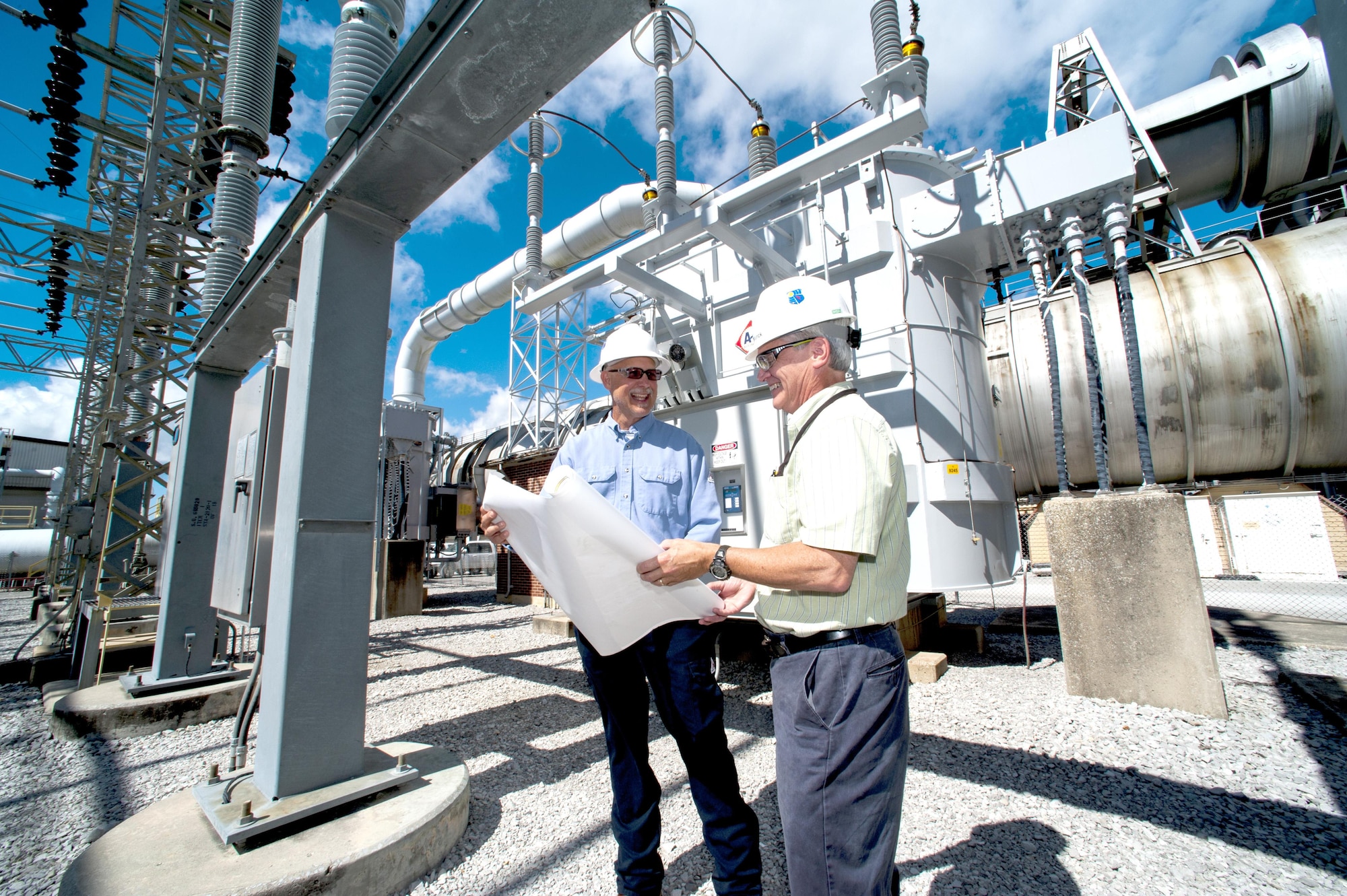 AEDC electrical engineers Tony Acklen and Howard Frederick review the Mid-Pressure Arc Heater project plans for adding electrical loads to an existing Plenum Evacuation System substation transformer at AEDC. (U.S. Air Force Photo/Rick Goodfriend)