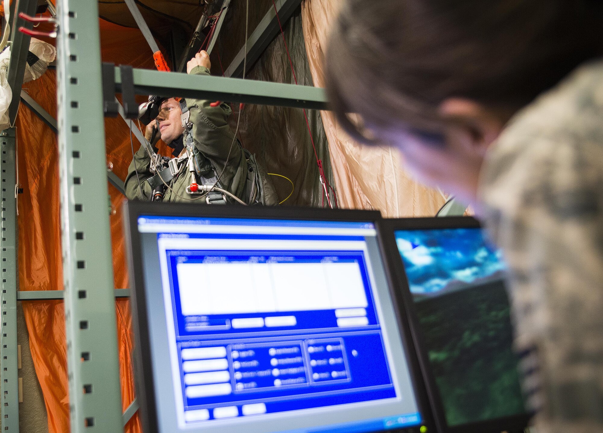 A 919th Special Operations Support Squadron member undergoes parachute simulation training at Duke Field Fla.  The Airmen in the Aircrew Flight Equipment section of 919th SOSS ensure all flight gear and training is current and up to date for the wing’s flying personnel.  (U.S. Air Force photo/Tech. Sgt. Sam King)