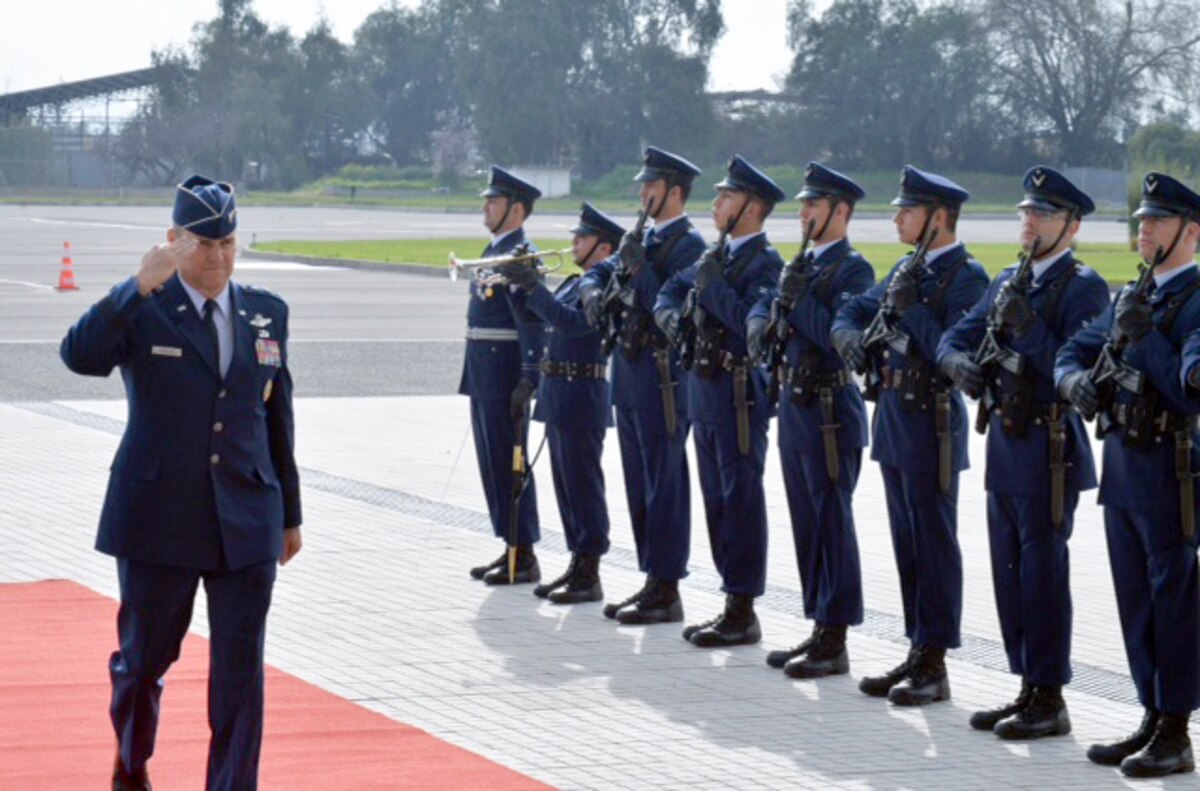 Lt. Gen. Chris Nowland, 12th Air Force (Air Forces Southern) commander, salutes as he's greeted upon arrival in Chile Aug. 19, 2016. The chief of the Chilean Air Force awarded the Chilean Grand Cross of Aeronautical Merit to the general during a visit to Santiago. (Photo courtesy Chilean Air Force)