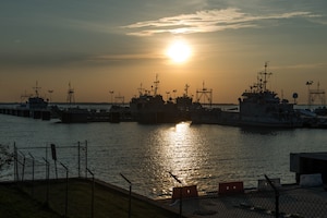 The sun sets on Third Port as the U.S. Army Training and Doctrine Command Band begins the season finale for the “Music Under the Stars” concert series at Fort Eustis, Va., Aug. 25, 2016. The performance concluded the summer concert series, which featured the bands different styles of music. (U.S. Air Force photo by Airman 1st Class Derek Seifert) 