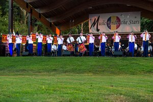 U.S. Army Training and Doctrine Command Band bugle players perform during the final “Music Under the Stars” concert at Fort Eustis, Va., Aug. 25, 2016. The band performed every Thursday night throughout the summer for the “Music Under the Stars” concert series. (U.S. Air Force photo by Airman 1st Class Derek Seifert)