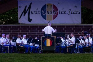 U.S. Army Training and Doctrine Command (TRADOC) Band perform during the final “Music Under the Stars” concert at Fort Eustis, Va., Aug. 25, 2016. The TRADOC band performs several concerts in support of local, regional and national events including festivals, parades and city and state commemorations. (U.S. Air Force photo by Airman 1st Class Derek Seifert)
