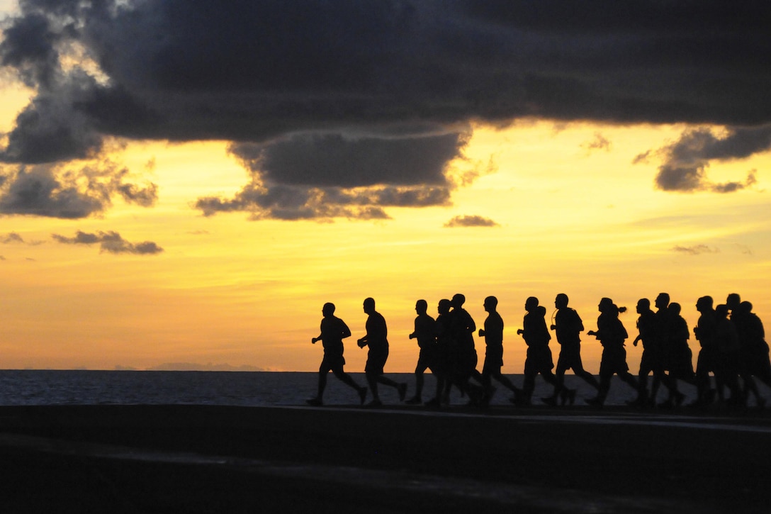 Navy chief petty officers and chief petty officer selectees run across the flight deck aboard the aircraft carrier USS George H.W. Bush in the Atlantic Ocean, Aug. 26, 2016. The aircraft carrier is conducting routine training and qualifications for an upcoming deployment. Navy photo by Seaman Tristan Lotz
