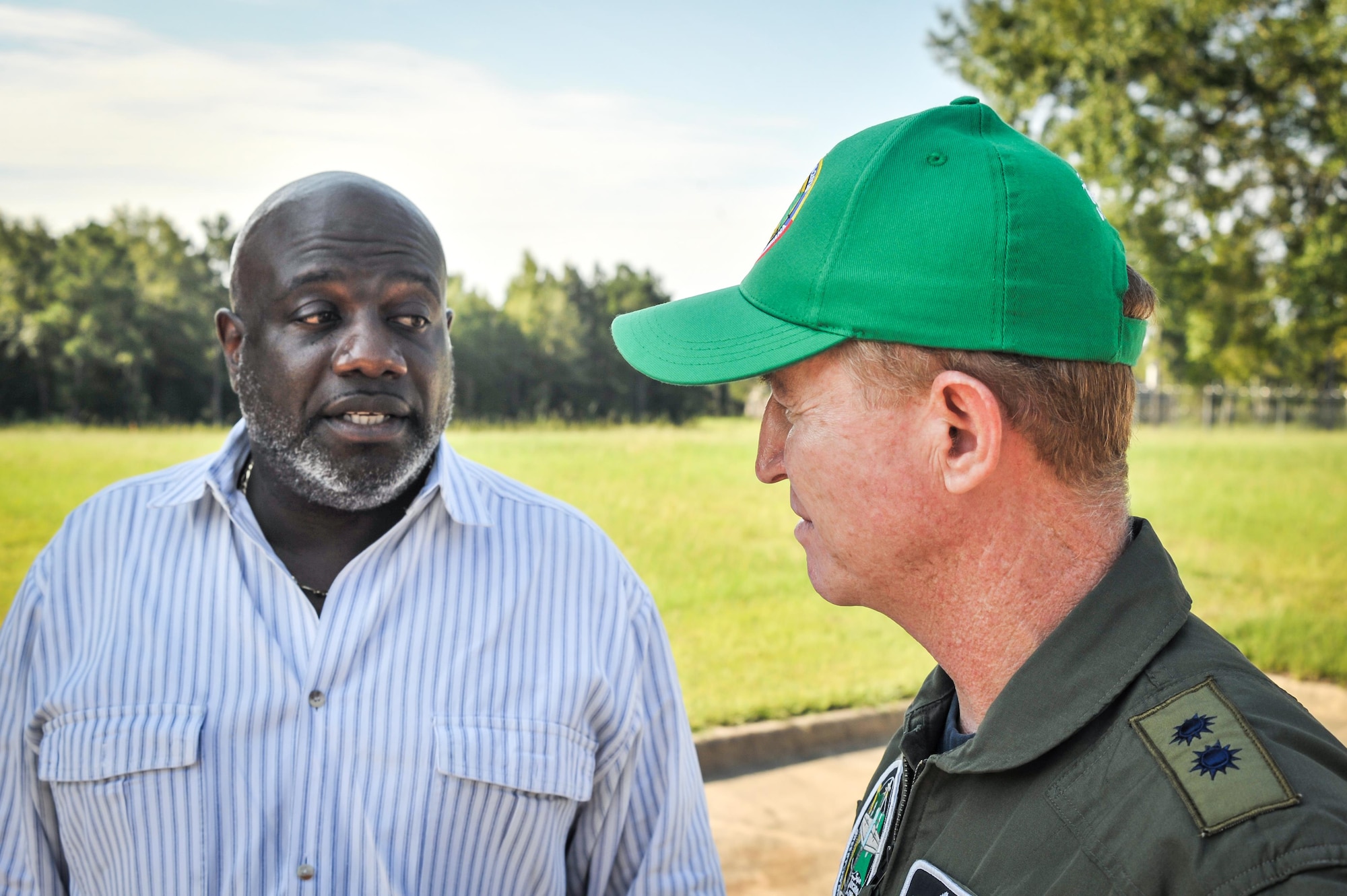 Colombian Air Force Brig. Gen. Rodrigo Alejandro Valencia Guevara (right) speaks with Terrance Trammell, director of operations at the Bossier City, La., Salvation Army Aug. 27, 2016. Colombian Airmen visiting Barksdale Air Force Base, La., donated supplies to the local Salvation Army for delivery to relief centers in central Louisiana following weeks of torrential rain and flooding in the region. (U.S. Air Force photo / Senior Airman Mozer O. Da Cunha)