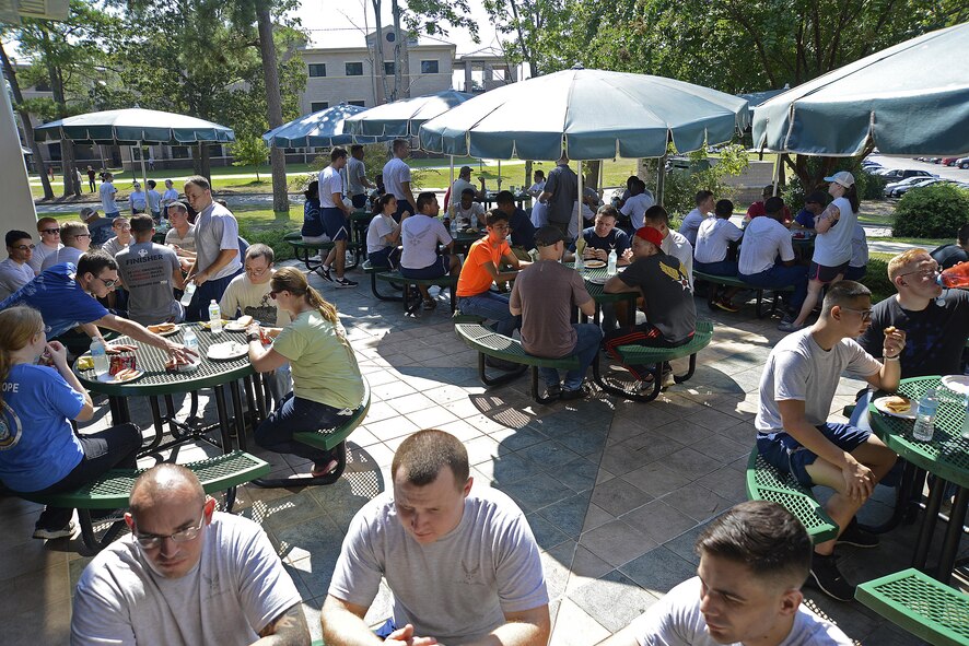 Members of Team Shaw gather together for an endoftheday
BBQ to celebrate after cleaning the dorms at Shaw Air Force Base, S.C., Aug. 27, 2016. The dorm cleanup gives supervisors and their Airmen an opportunity to relate to each other in a more casual environment. (U.S. Air Force photo by Airman BrieAnna Stillman)