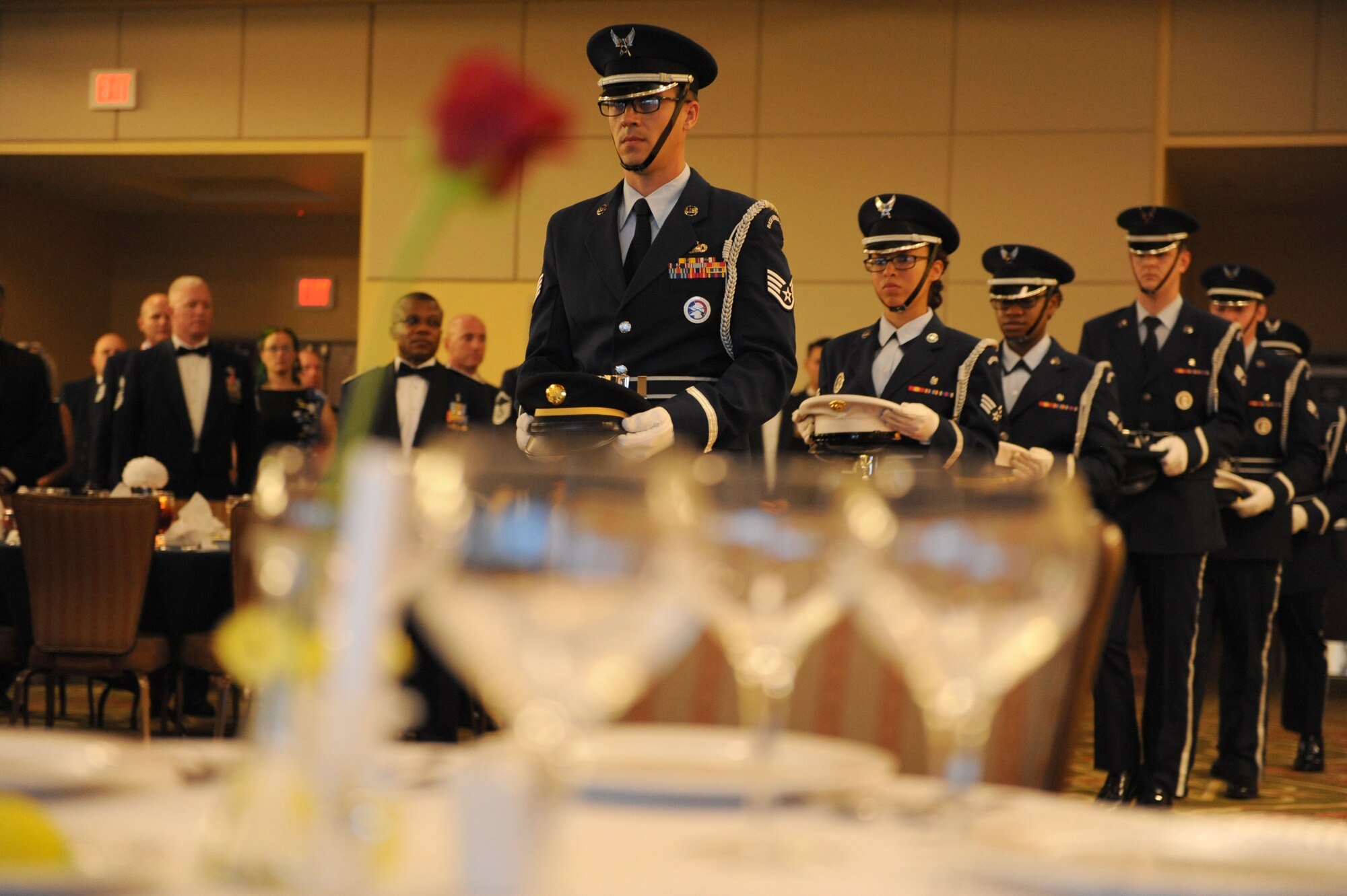 Members of the Keesler Air Force Base Honor Guard perform a POW/MIA table ceremony during the Senior Noncommissioned Officer Induction Ceremony at the Bay Breeze Event Center Aug. 18, 2016, on Keesler Air Force Base, Miss. Thirty-seven enlisted members were recognized and received a commemorative medallion at the event. (U.S. Air Force photo by Kemberly Groue/Released)
