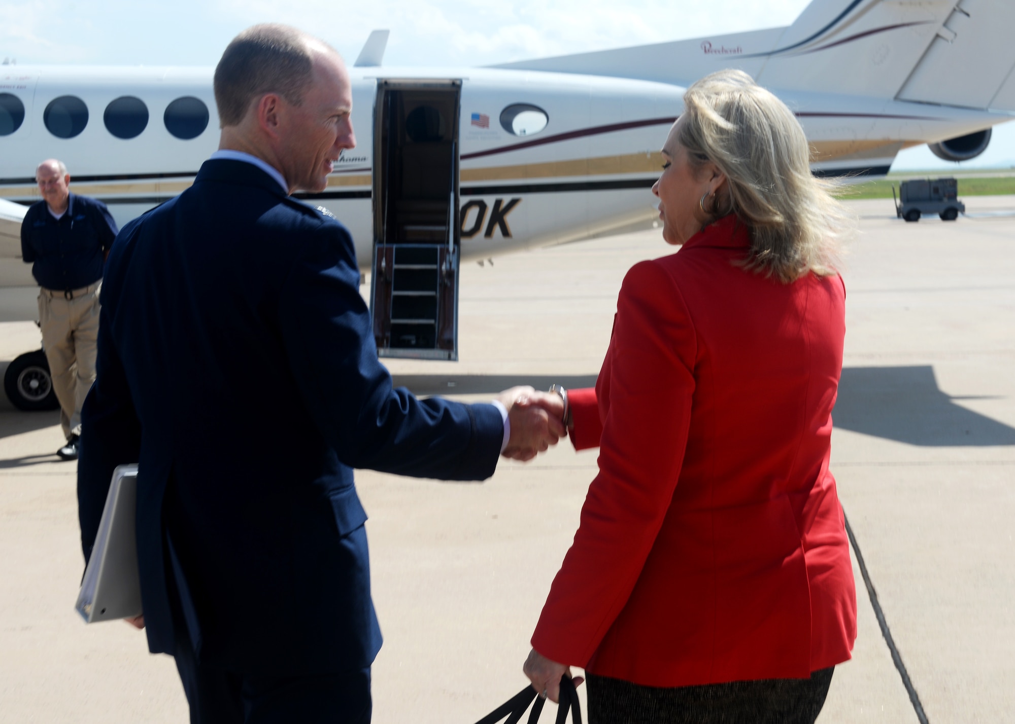 Oklahoma Governor Mary Fallin shakes hands with U.S. Air Force Col. Charles Ohliger, 97th Air Mobility Wing vice commander, as she prepares to leave after the “Forging the 46” event, Aug. 30, 2016, at Altus Air Force Base, Okla. The event consisted of an assumption of command for the reactivated 56th Air Refueling Squadron, dedication of the new KC-46 training facility, speeches from key Air Force and community leaders and concluded with a tour of the new facility for attendees.  (U.S. Air Force Photo by Airman Jackson N. Haddon/Released).