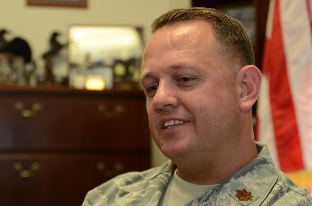 Air Force Maj. Tony Wickman, the deputy commandant of the Defense Information School on Fort Meade, speaks with a visitor Aug. 15, 2016, at the school. Wickman became the deputy commandant in July.