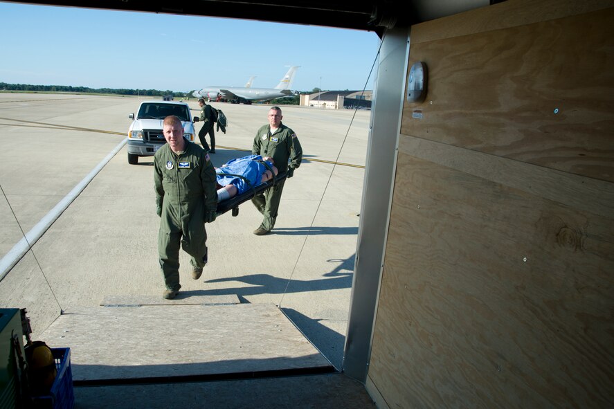 Members of the 459th Aeromedical Evacuation Squadron load litters onto transport vehicles on the Joint Base Andrews, Maryland, flight line Sunday, Aug. 28, 2016, upon return from joint-unit, multi-aircraft training at Peterson Air Force Base, Colorado. More than a dozen AES flight nurses, technicians and administrators flew to Peterson to conduct joint unit training with other AE squadrons on board the KC-135R Stratotanker, C-17 Globemaster III and C-130H3 Hercules. Serving as a medical transport unit, the 459th AES trained for various medical conditions and situations. (U.S. Air Force photo/Staff Sgt. Kat Justen)