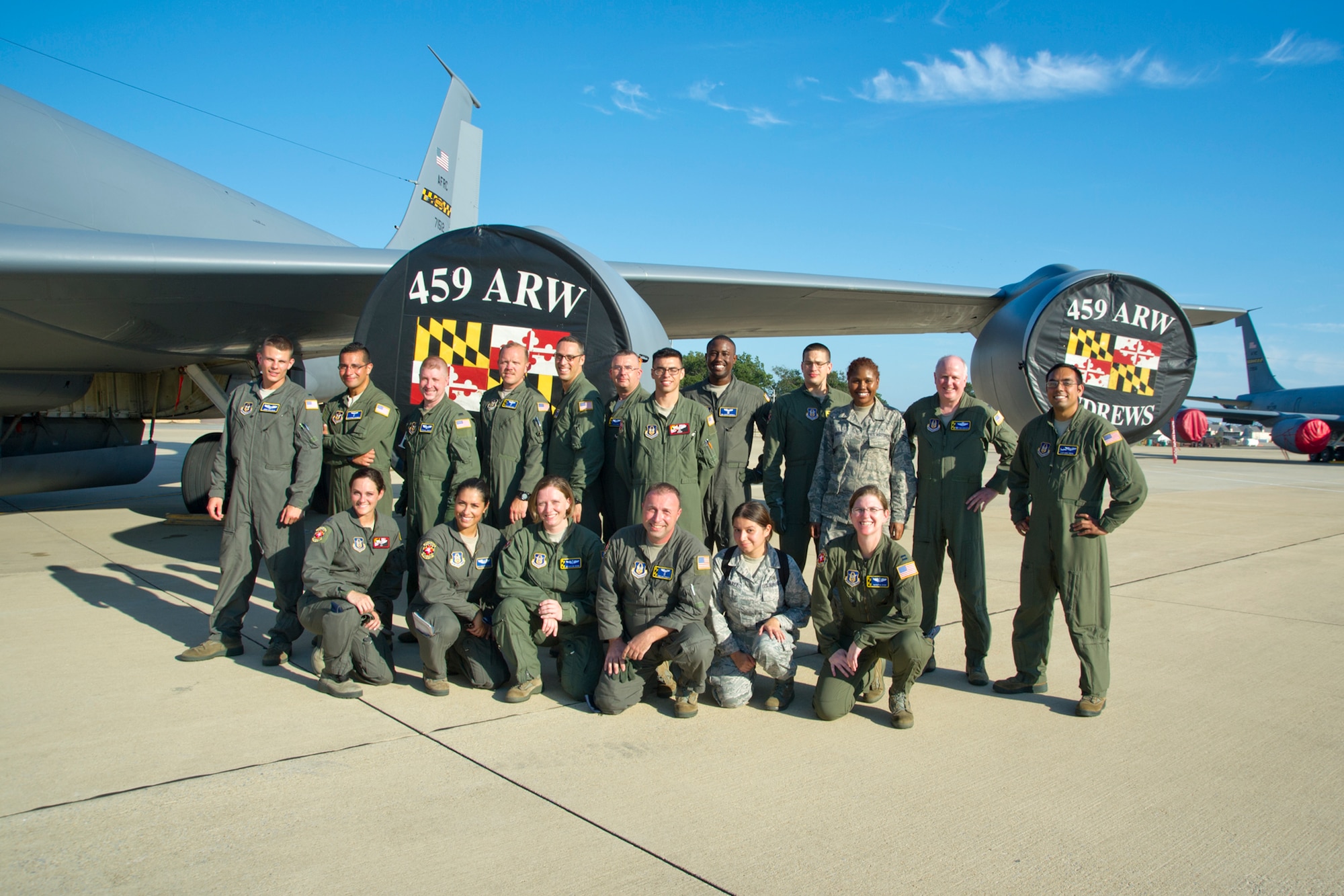 Members of the 459th Aeromedical Evacuation Squadron and 459th Operation Group pose for a group photo on the Joint Base Andrews, Maryland, flight line Sunday, Aug. 28, 2016, upon return from joint-unit, multi-aircraft training at Peterson Air Force Base, Colorado. More than a dozen AES flight nurses, technicians and administrators flew to Peterson to conduct joint unit training with other AE squadrons on board the KC-135R Stratotanker, C-17 Globemaster III and C-130H3 Hercules. Serving as a medical transport unit, the 459th AES trained for various medical conditions and situations. (U.S. Air Force photo/Staff Sgt. Kat Justen)