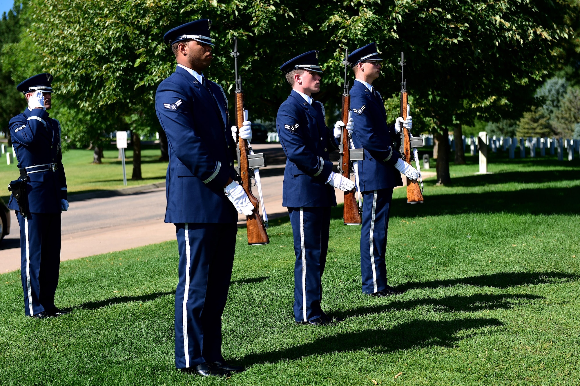 U.S. Air Force Mile High Honor Guard members finish a three volley rifle salute during a funeral August 30, 2016, at Fort Logan National Cemetery, Colo. The three volleys originally indicated that casualties had been cared for during combat, but over time they have become known as honoring the fallen. (U.S. Air Force photo by Airman 1st Class Gabrielle Spradling/Released)
