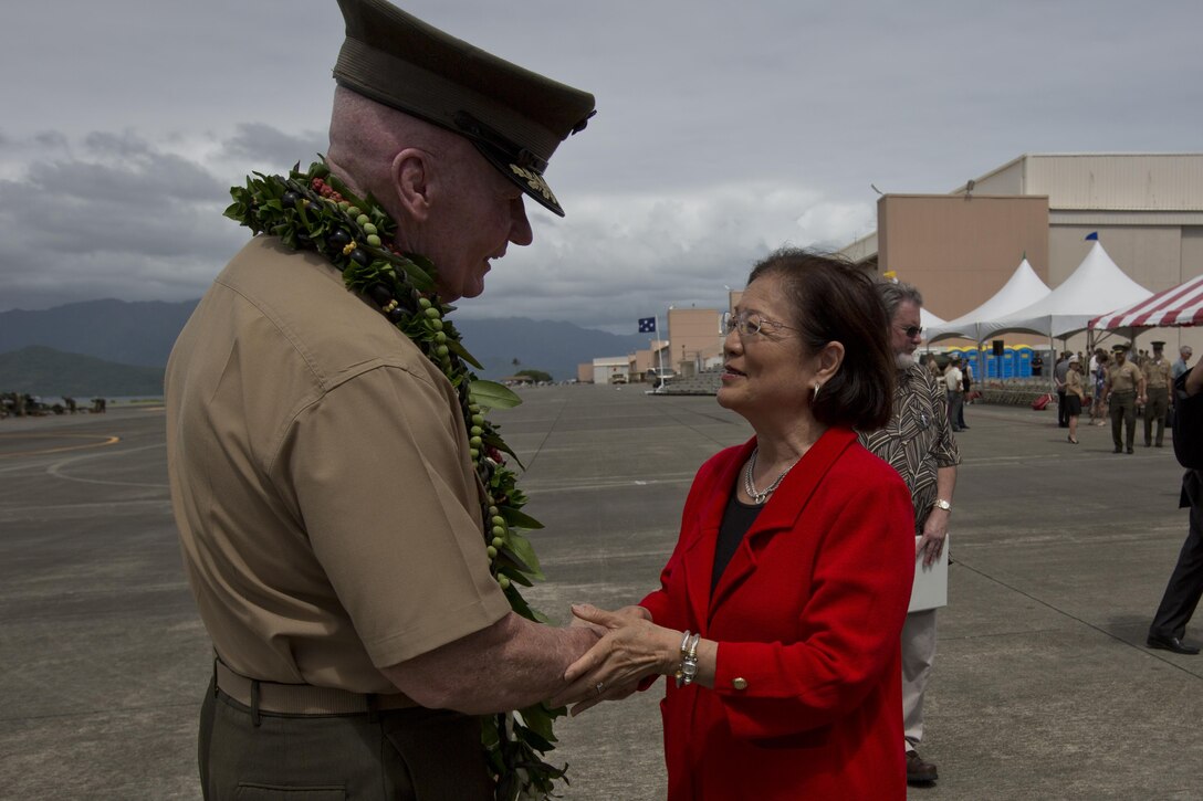 Lt. Gen. John A. Toolan, the outgoing commander of U.S. Marine Corps Forces, Pacific, speaks with Hawaii State Senator Mazie Hirono during a change of command ceremony at Marine Corps Base Hawaii, Aug. 26, 2016. During the ceremony, Toolan relinquished command to Lt. Gen. David H. Berger. 