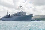 Sailors aboard the submarine tender USS Emory S. Land (AS 39) man the rails as the ship returns from deployment, April 11, 2016.   The return to Guam is Emory S. Land's first, since changing homeport from Diego Garcia to Guam Dec. 23. Emory S. Land is an expeditionary submarine tender conducting coordinated tended moorings and afloat maintenance in the U.S. 5th and 7th Fleet areas of operations.