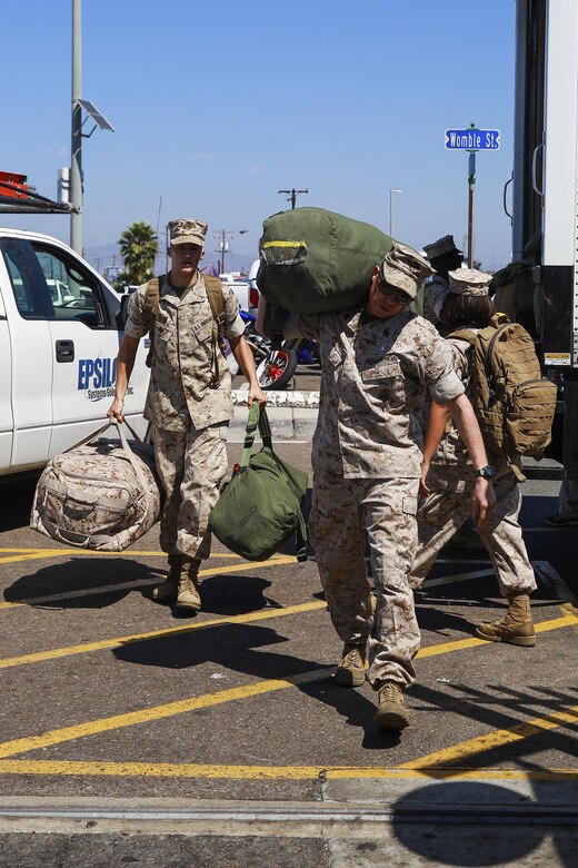 Marines with Task Force Los Angeles prepare to load their bags onto the USS America (LHA 6) at Naval Base San Diego, Calif., Aug. 29, 2016. The ship will carry Marines, Sailors, and Coast Guardsmen to Los Angeles Fleet Week, Sept. 2 – Sept. 5. Fleet Weeks are annual patriotic events where active Navy and Coast Guard ships dock in major U.S. cities giving Marines, Sailors and Coast Guardsmen an opportunity to interact with locals. This is the first year L.A. has hosted an official Fleet Week event. (U.S. Marine Corps photo by Lance Cpl. Caitlin Bevel)