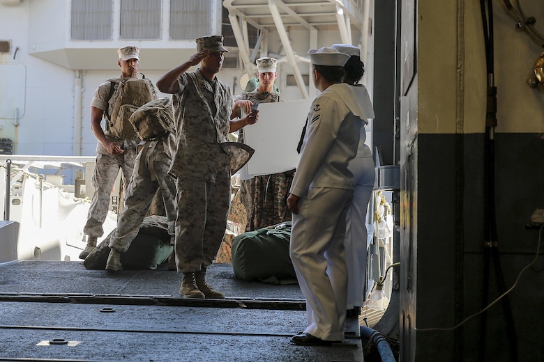 Pfc. Luis Moreno, a combat engineer with 7th Engineer Support Battalion, 1st Marine Logistics Group, I Marine Expeditionary Force, requests permission to board the USS America (LHA 6) at Naval Base San Diego, Calif., Aug. 29, 2016. The ship will carry Marines, Sailors, and Coast Guardsmen to Los Angeles Fleet Week, Sept. 2 – Sept. 5. Fleet Weeks are annual patriotic events where active Navy and Coast Guard ships dock in major U.S. cities giving Marines, Sailors and Coast Guardsmen an opportunity to interact with locals. This is the first year L.A. has hosted an official Fleet Week event. (U.S. Marine Corps photo by Lance Cpl. Caitlin Bevel)