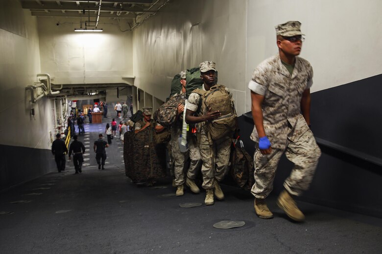 Marines with Task Force Los Angeles board the USS America (LHA 6) at Naval Base San Diego, Calif., Aug. 29, 2016. The ship will carry Marines, Sailors, and Coast Guardsmen to Los Angeles Fleet Week, Sept. 2 – Sept. 5. Fleet Weeks are annual patriotic events where active Navy and Coast Guard ships dock in major U.S. cities giving Marines, Sailors and Coast Guardsmen an opportunity to interact with locals. This is the first year L.A. has hosted an official Fleet Week event. (U.S. Marine Corps photo by Lance Cpl. Caitlin Bevel)