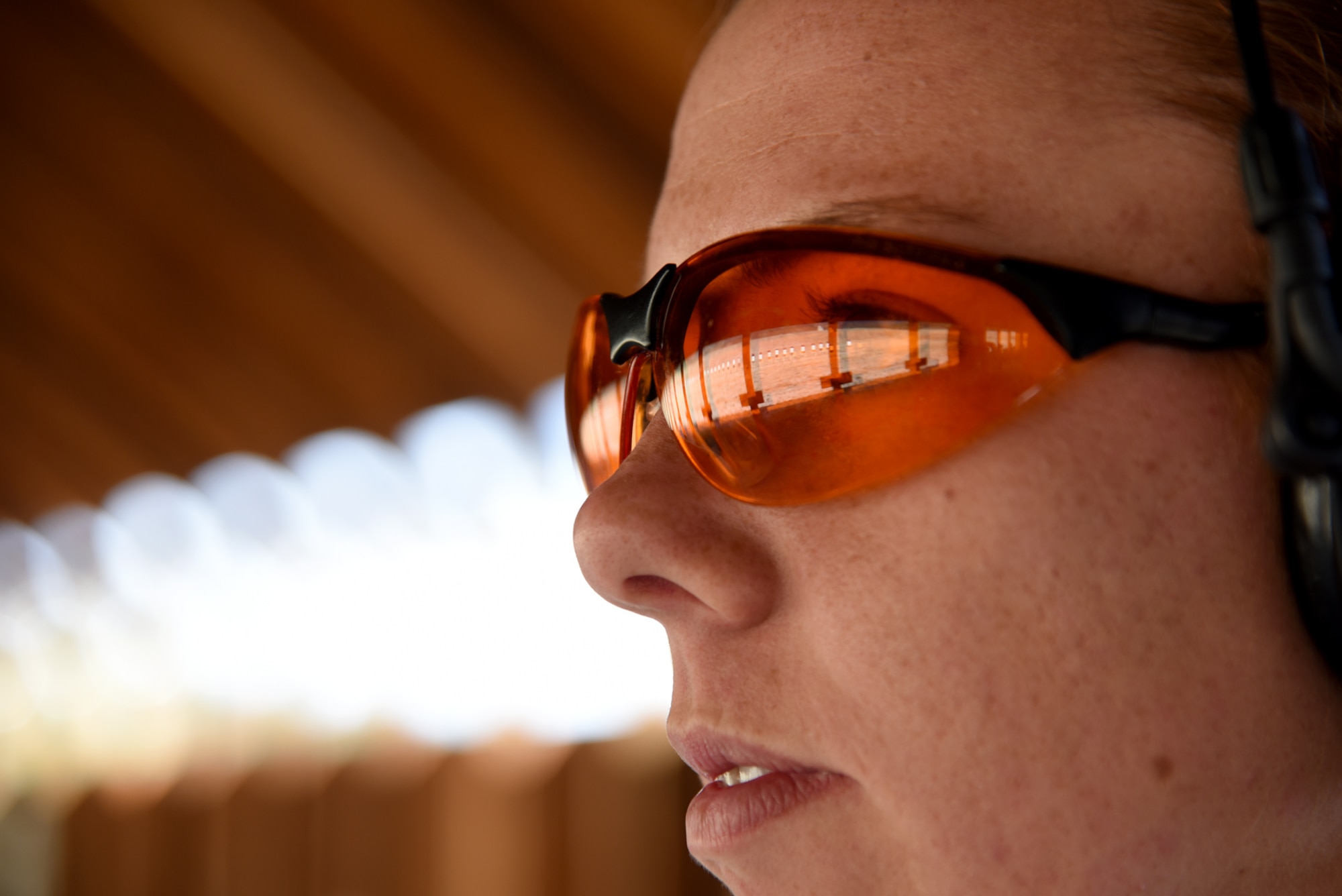 Staff Sgt. Montie Butler, 50th Security Forces Squadron combat arms instructor, looks out to the target area before the competition at the combat arms firing range at the United States Air Force Academy, Colo., Aug. 22, 2016. The match is an Air Force-level competition and competitors could qualify for the Elementary or Bronze Excellence in Competition Pistol Shot and Rifleman Badges (U.S. Air Force photo by Airman 1st Class Dennis Hoffman)