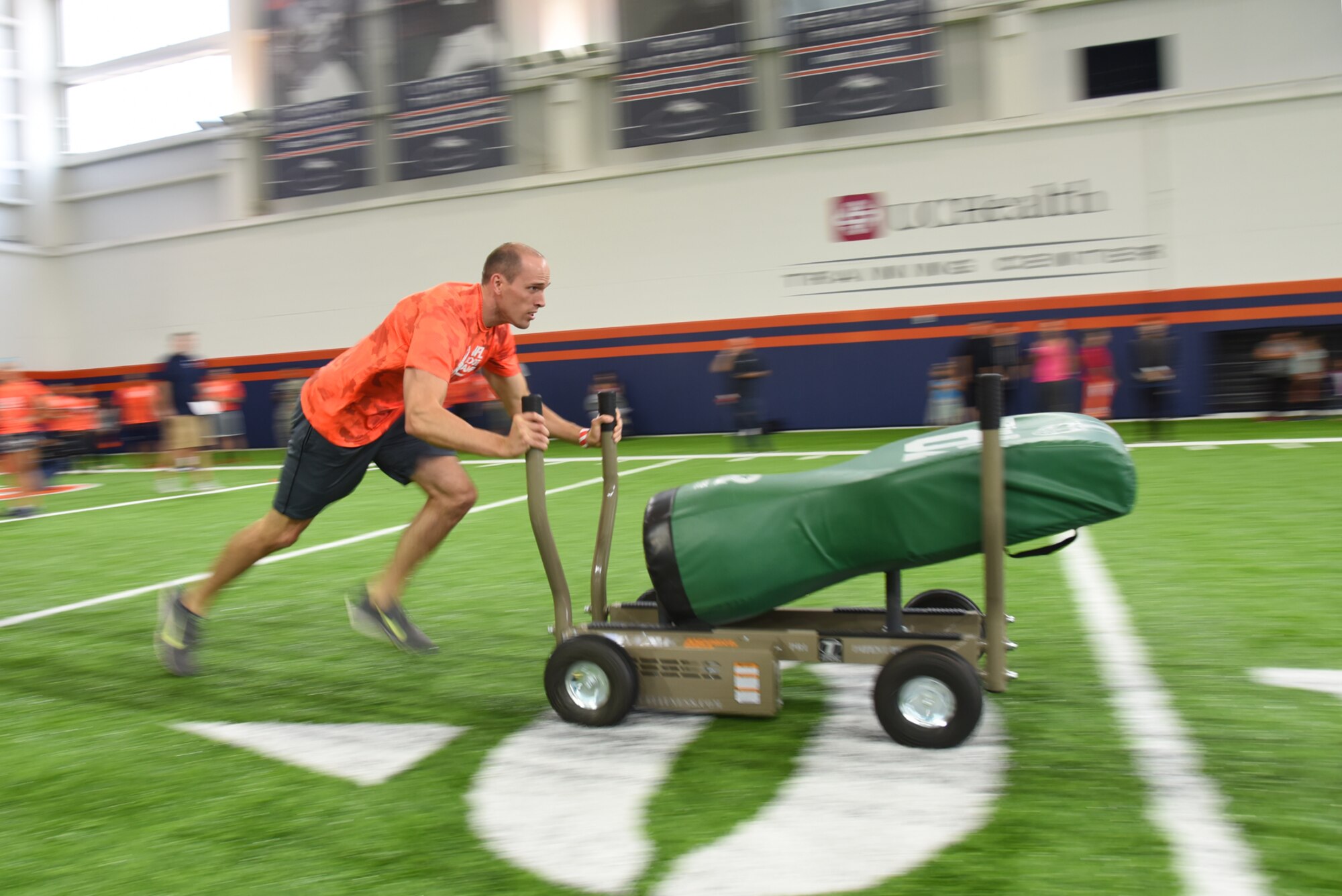 ENGLEWOOD, Colo. – Senior Airman David Farrey, 21st Comptroller Squadron financial analyst, competes in one of five different football drills similar to those used to evaluate NFL talent in an NFL boot camp at Denver Broncos UCHealth Training Center Fieldhouse, Denver, Colo., Aug. 25, 2016. Team Pete Airmen and service members across Colorado gathered to take part in the NFL boot camp. (U.S. Air Force photo by Airman 1st Class Dennis Hoffman)