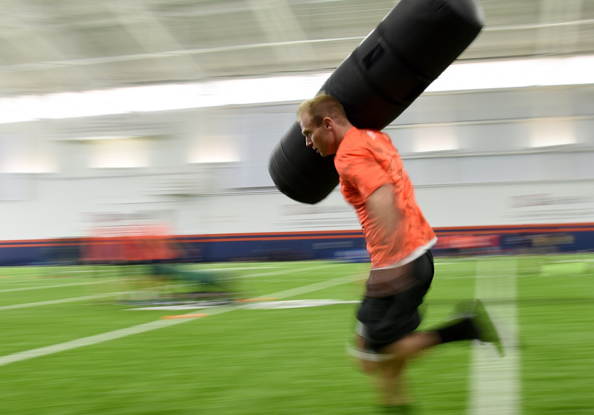 ENGLEWOOD, Colo. – 2nd Lt. Jared Jones, 21st Logistics Readiness Squadron material management flight commander, competes in one of five different football drills similar to those used to evaluate NFL talent in an NFL boot camp at Denver Broncos UCHealth Training Center Fieldhouse, Denver, Colo., Aug. 25, 2016. Team Pete Airmen and service members across Colorado gathered to take part in the NFL boot camp. (U.S. Air Force photo by Airman 1st Class Dennis Hoffman)