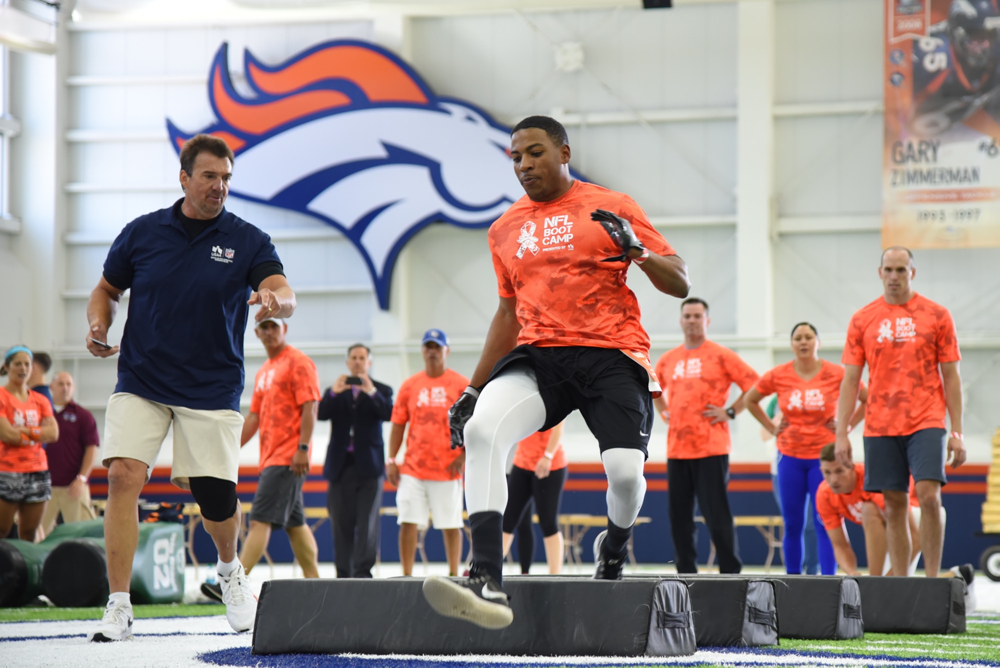 ENGLEWOOD, Colo. – Airman 1st Class Ceron Cherry, 21st Force Support Squadron career development journeyman, competes in one of five different football drills similar to those used to evaluate NFL talent in an NFL boot camp at Denver Broncos UCHealth Training Center Fieldhouse, Denver, Colo., Aug. 25, 2016. Team Pete Airmen and service members across Colorado gathered to take part in the NFL boot camp. (U.S. Air Force photo by Airman 1st Class Dennis Hoffman)