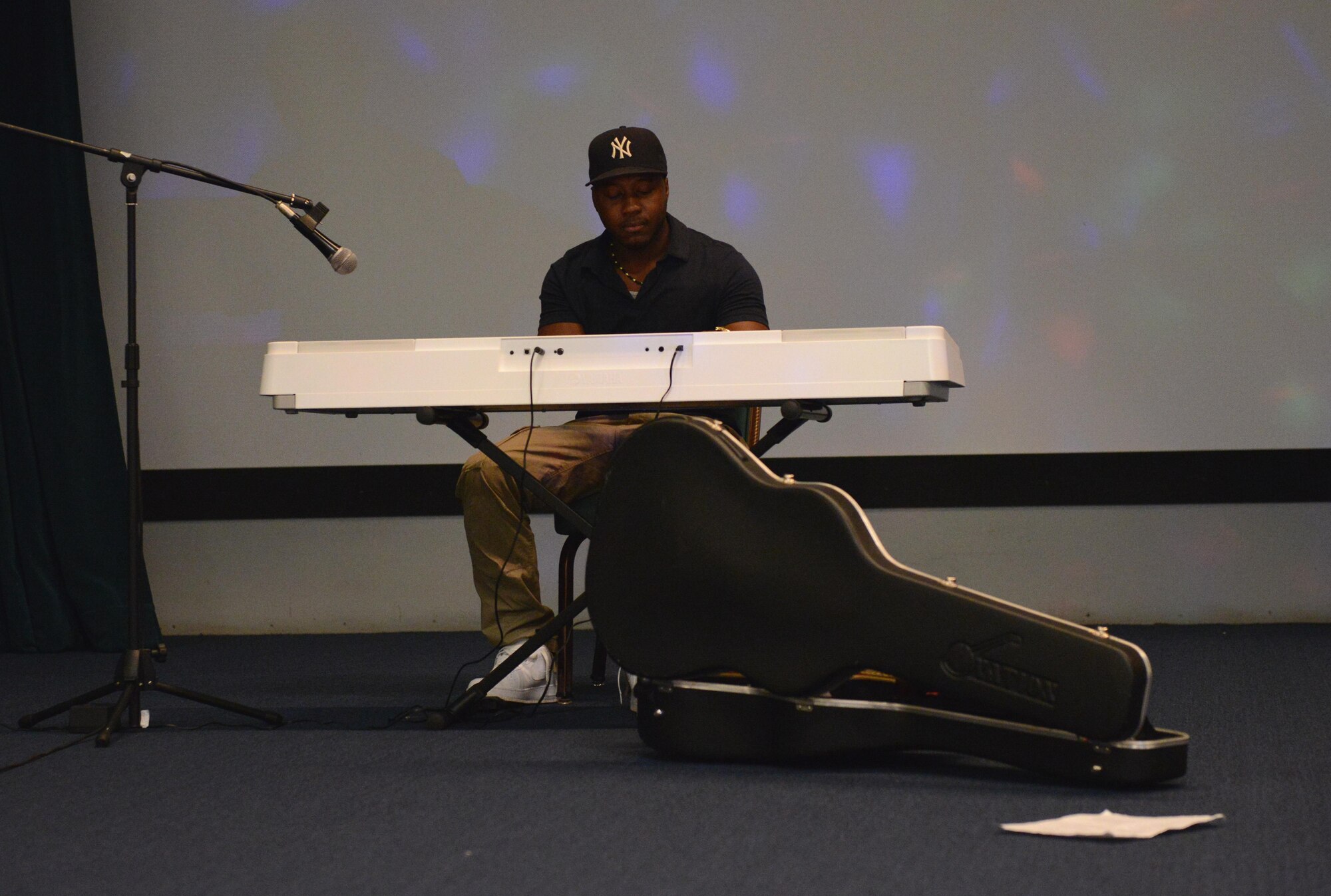 Airman 1st Class Blake Brooks, 36th Medical Operations Squadron public health technician, plays the keyboard during a Women’s Equality Day event Aug. 26, 2016, at Andersen Air Force Base, Guam. The event was held to commemorate the ratification of the 19th amendment and showcased a number of performances. (U.S. Air Force photo by Airman 1st Class Arielle Vasquez/Released)