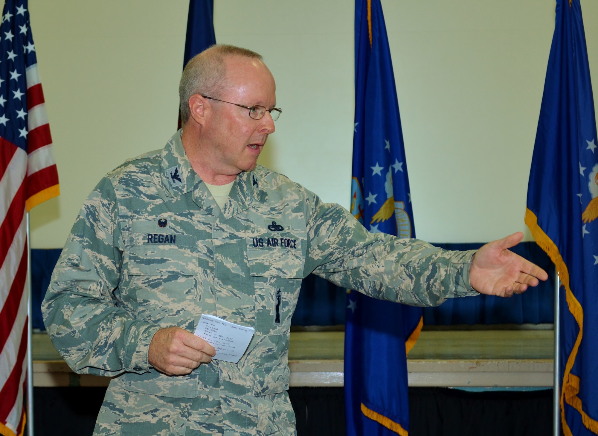 Col. Mike Regan, currently the 111th Mission Support Group commander, addresses an audience composed of 111th Attack Wing members during an assumption of command ceremony held at Horsham Air Guard Station, Pa., Aug. 13, 2016. Regan, slated to assume the position the Deputy Adjutant General-Air, Pennsylvania National Guard, Joint Force Headquarters, Fort Indiantown Gap, Pennsylvania, on Sept. 26, 2016, utilized humor along with pride in the Air National Guard while delivering his speech. (U.S. Air National Guard photo by Tech. Sgt. Andria Allmond)
